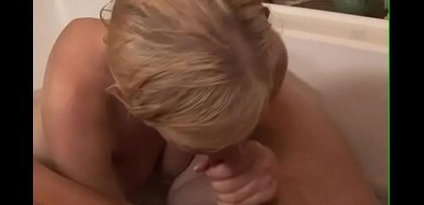  Petite blonde masseuse wanks cock in bath